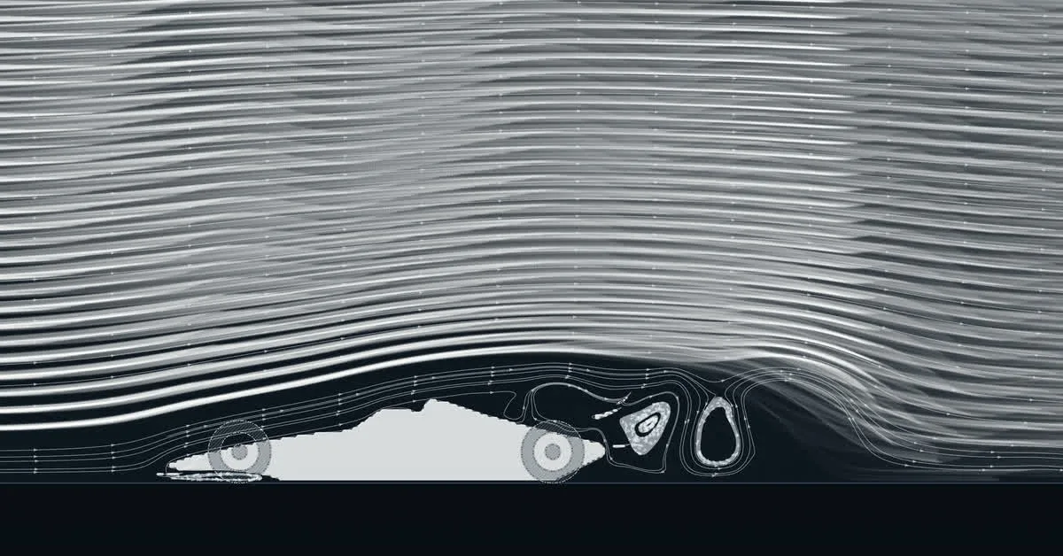 Smoke streaming over a Formula 1 car, with vortices shed behind the rear wing